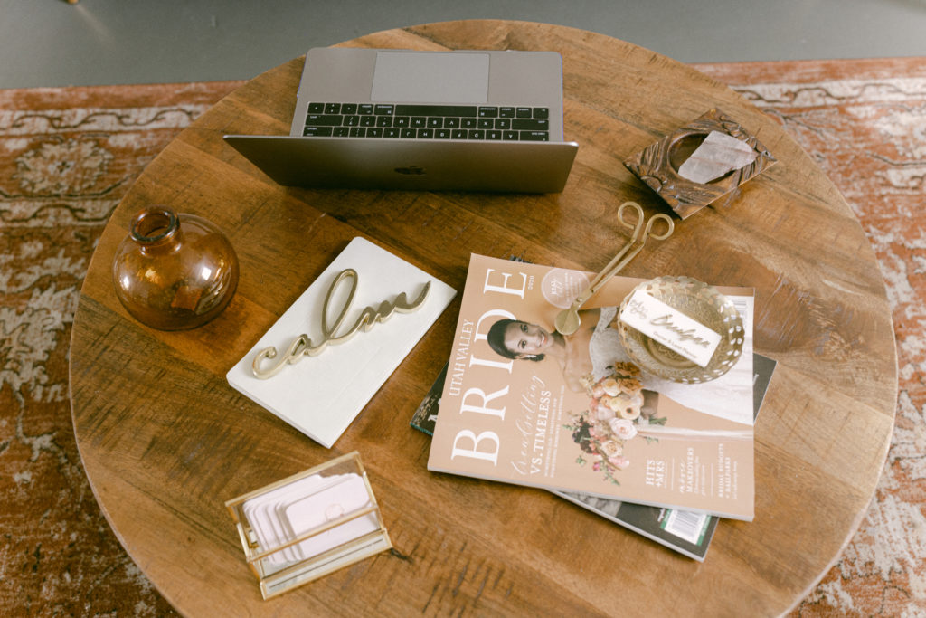 My coffee table inspiring my office decor space. I have my laptop opened up, my rose quarts crystal, a Bride magazine for inspiration, business cards and a calm decor  piece to set the tone.
