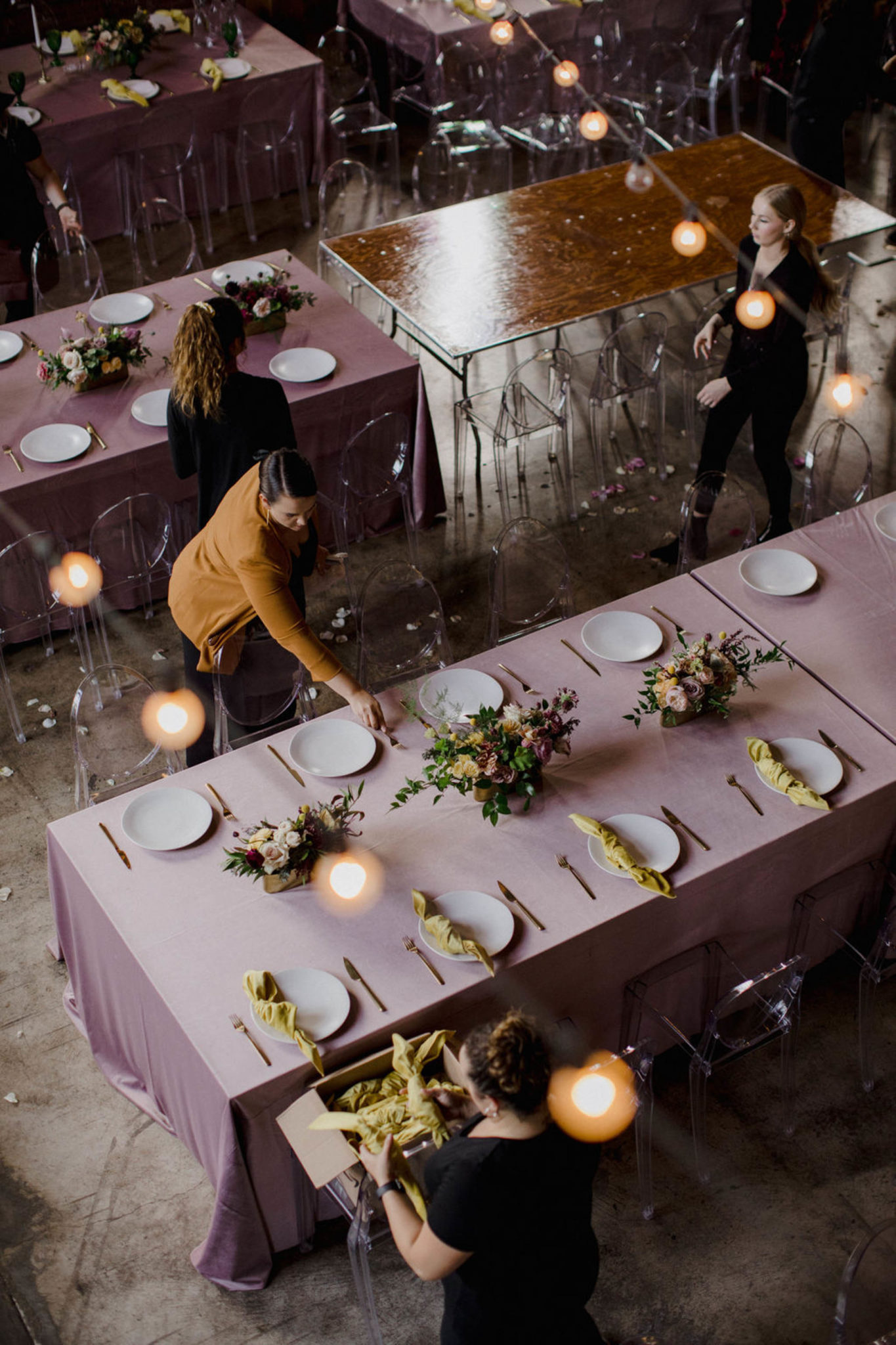 An image of wedding vendors actively setting up before the reception starts. The title on this image states "Wedding Vendor Tipping Guide". Sharing the how, who and when protocols of tipping your wedding vendor.