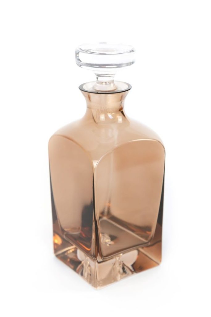 Amber colored glass decanter. One of our recommendations for the wedding gift guide.