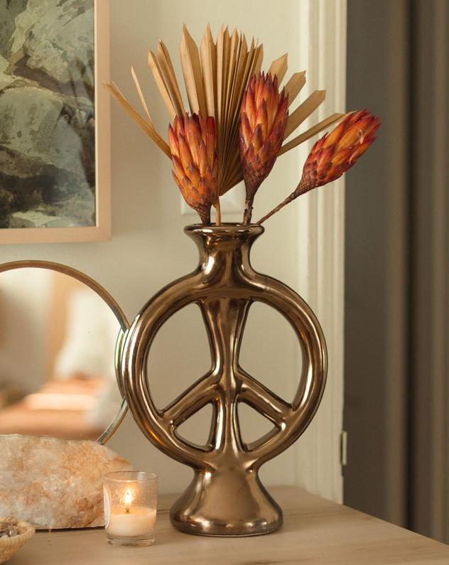 an image of a gold peace vase. One of our recommendations for the wedding gift guide.
